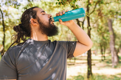 Man drinking water from bottle