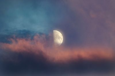 Low angle view of moon against sky at sunset