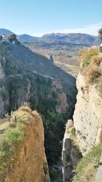 High angle view of river amidst mountains against clear sky