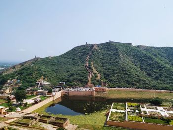 High angle view of buildings and mountains against clear sky