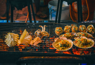 Close-up of meat on barbecue grill