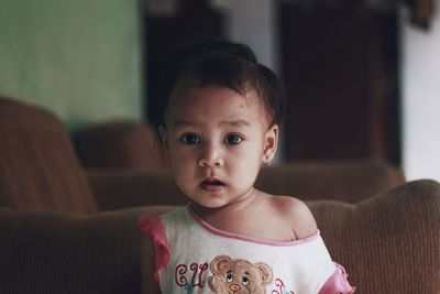 Portrait of cute baby at home