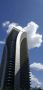 Low angle view of skyscraper against sky