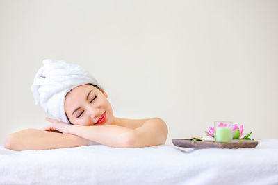 Midsection of woman lying on table