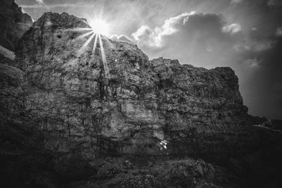 Low angle view of rock formation against sky