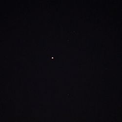 Low angle view of moon against sky at night