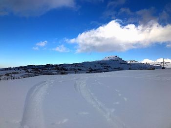 Scenic view of snow covered mountain against sky