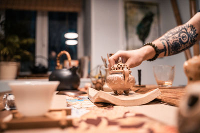 Midsection of woman preparing food on table