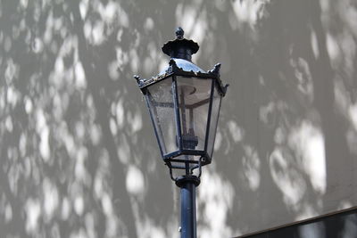 Low angle view of street light against sky