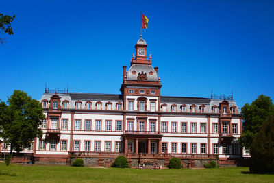 Low angle view of building against blue sky