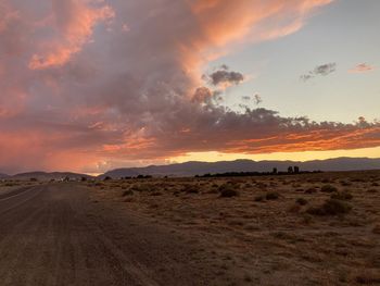 Scenic view of field against sky during sunset