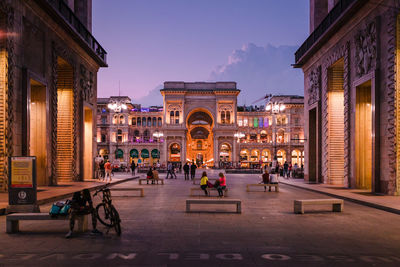 People walking on street in city