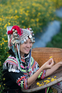 Portrait of a smiling young woman looking away