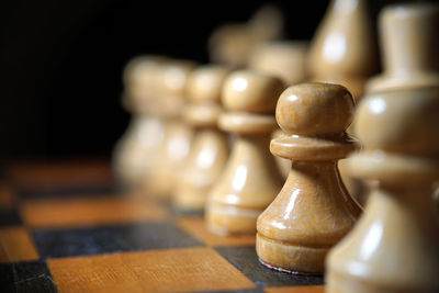 Close-up of chess pieces on board