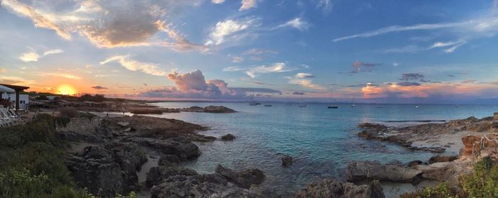 Scenic view of sea against sky at sunset