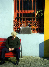 Man sitting in front of building