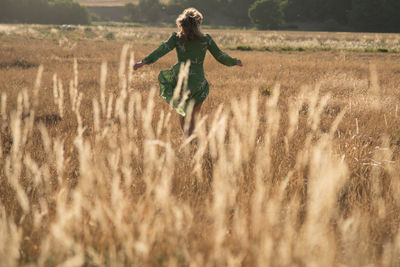 Full length of woman on field