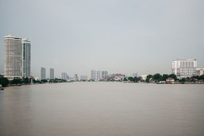 Modern buildings in city against clear sky