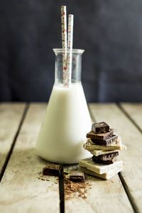 Close-up of chocolate and milk on table