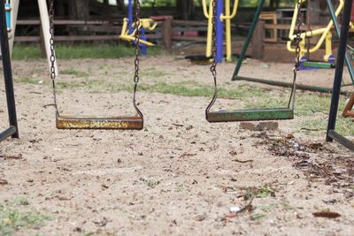 Rusty swings at playground