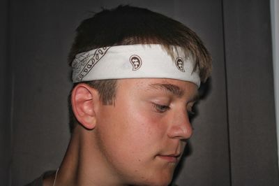 Close-up portrait of young man looking away