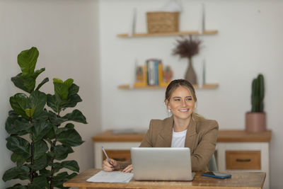 Woman working at home with laptop. home office.  notebook for working. 