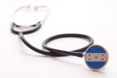 Close-up of stethoscope against white background