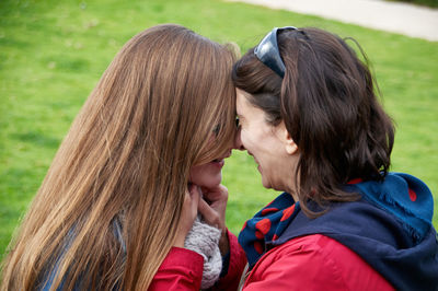 Mother and daughter outdoors