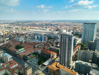 High angle view of modern buildings in city against sky