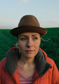 Portrait of young woman wearing hat