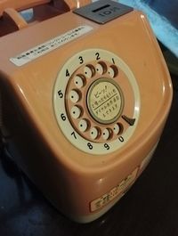 High angle view of telephone booth on table