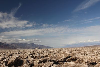 Scenic view of arid landscape against sky