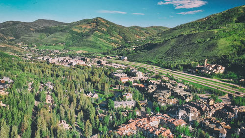 High angle view of trees and buildings against sky