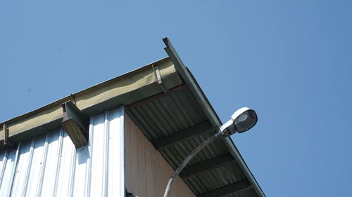 Low angle view of building against clear blue sky