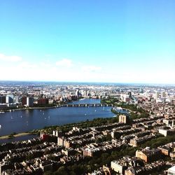 View of cityscape against blue sky