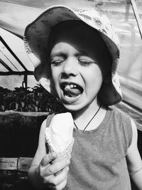 Portrait of mid adult woman against ice cream