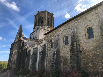 Low angle view of old building against sky