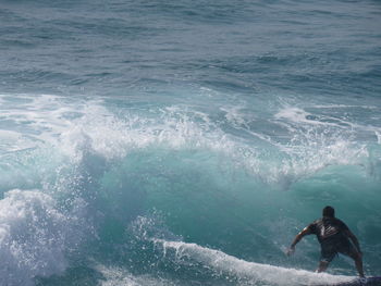 Man swimming in sea