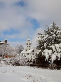 View of church against cloudy sky during winter