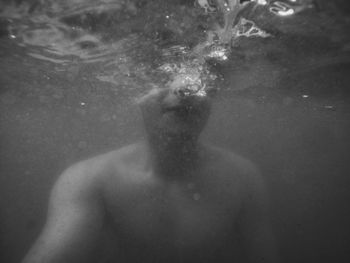 Close-up of shirtless man in water