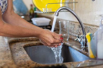 Person washing hands before cooking. healthy eating