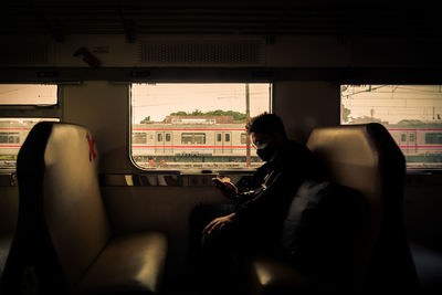 Woman sitting in train