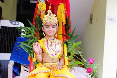 Portrait of cute girl wearing lord krishna costume