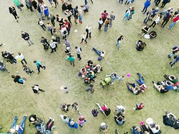 High angle view of people sitting on floor