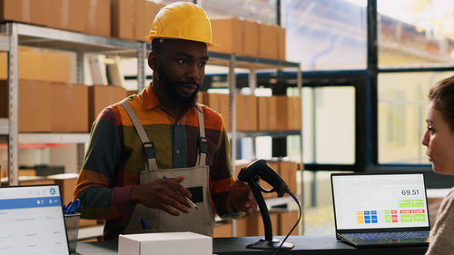 Portrait of young woman working in office