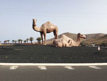 Elephant sculpture against clear sky