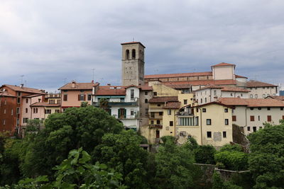 Buildings in city against sky