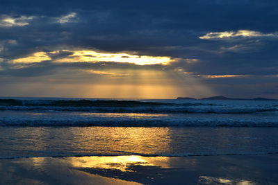 Scenic view of sea at sunset