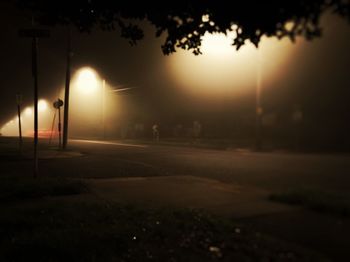 View of illuminated street at night