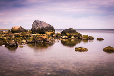 Scenic view of sea against cloudy sky
